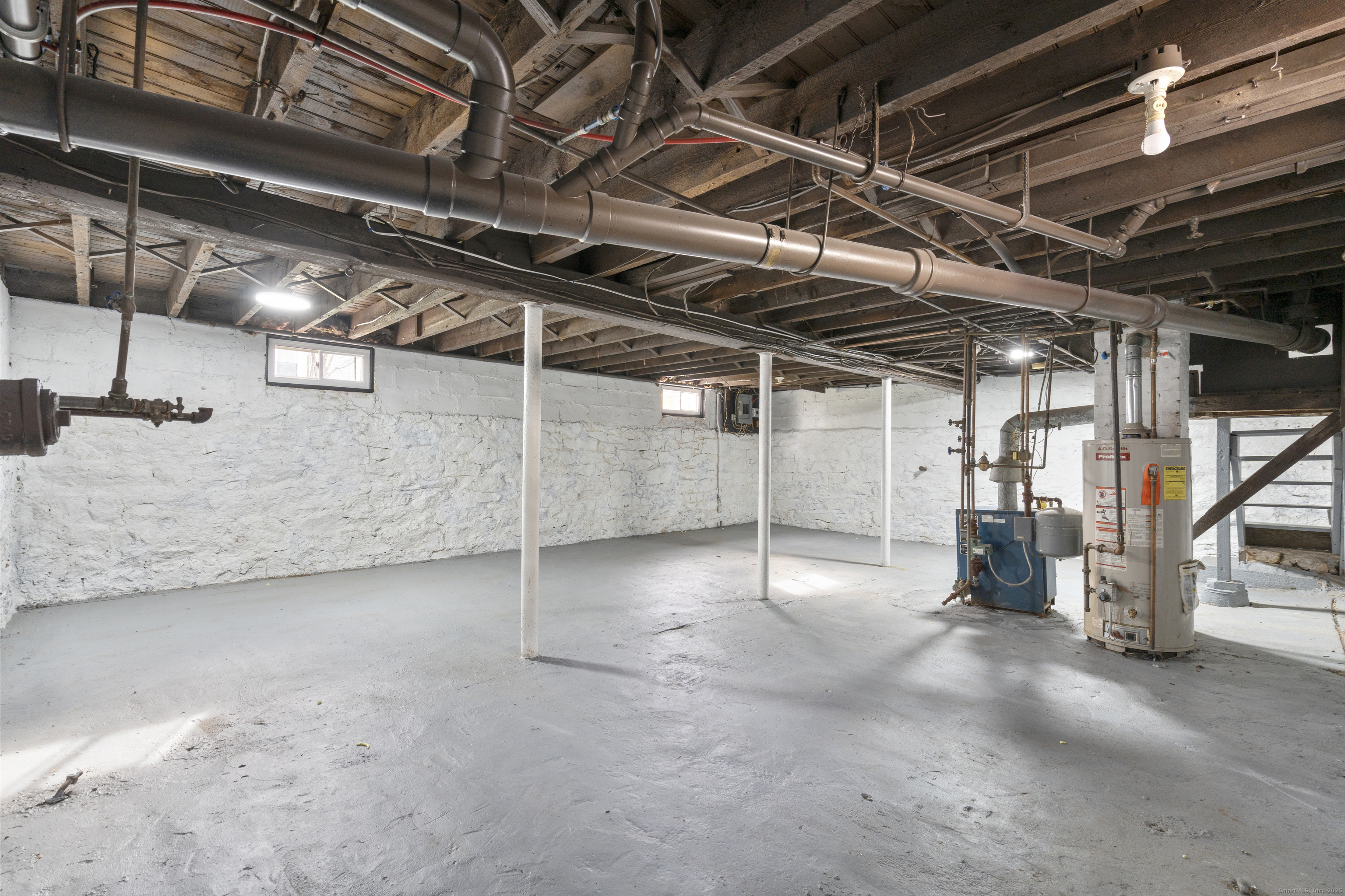 63 Irving Street Manchester, CT 06042 - Photo 31 of 39 a view of empty room with wooden ceiling