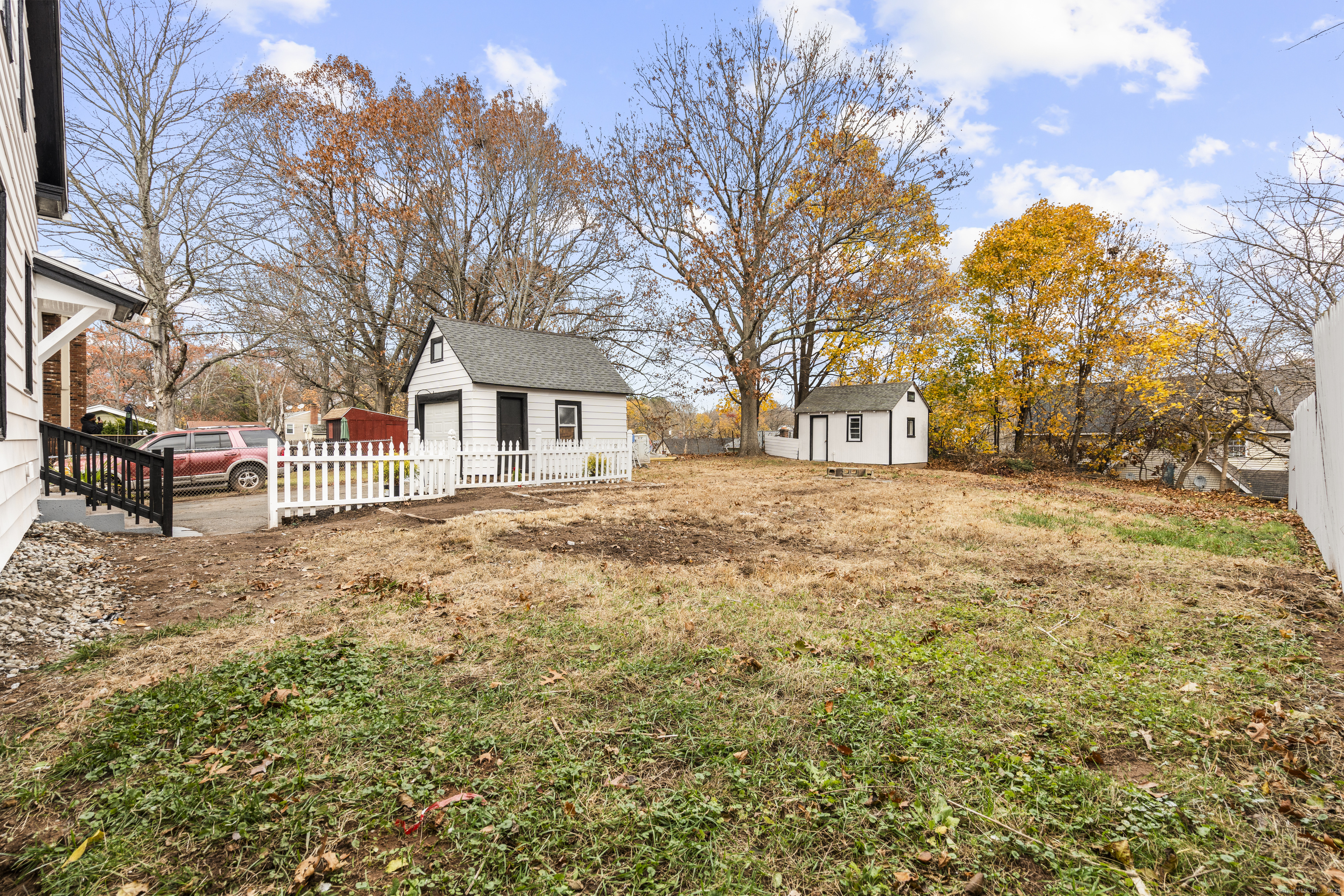 63 Irving Street Manchester, CT 06042 - Photo 34 of 39 a front view of a house with a yard covered in snow