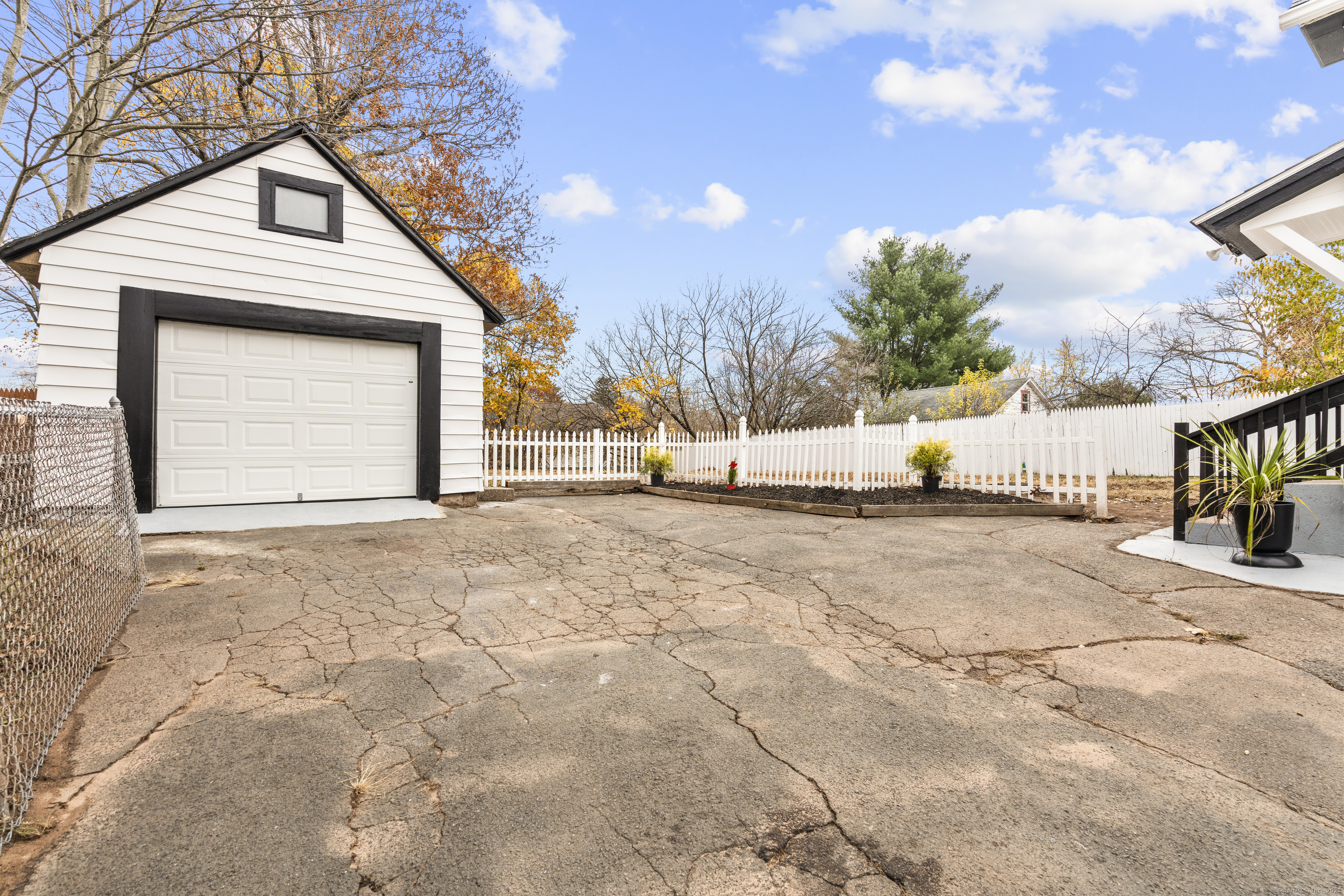 63 Irving Street Manchester, CT 06042 - Photo 38 of 39 a view of a house with snow on the road