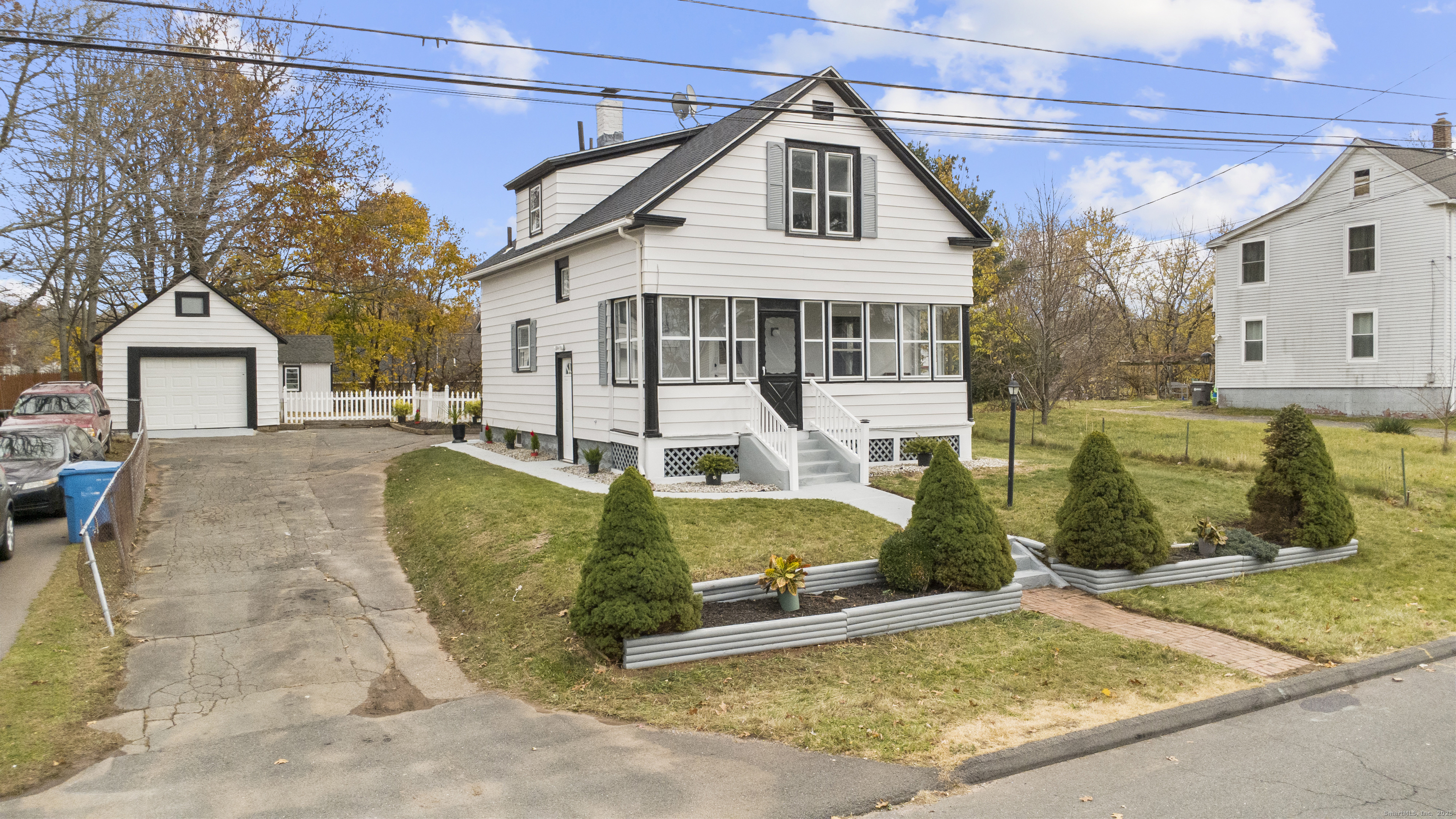 63 Irving Street Manchester, CT 06042 - Photo 39 of 39 a view of a white house with a yard