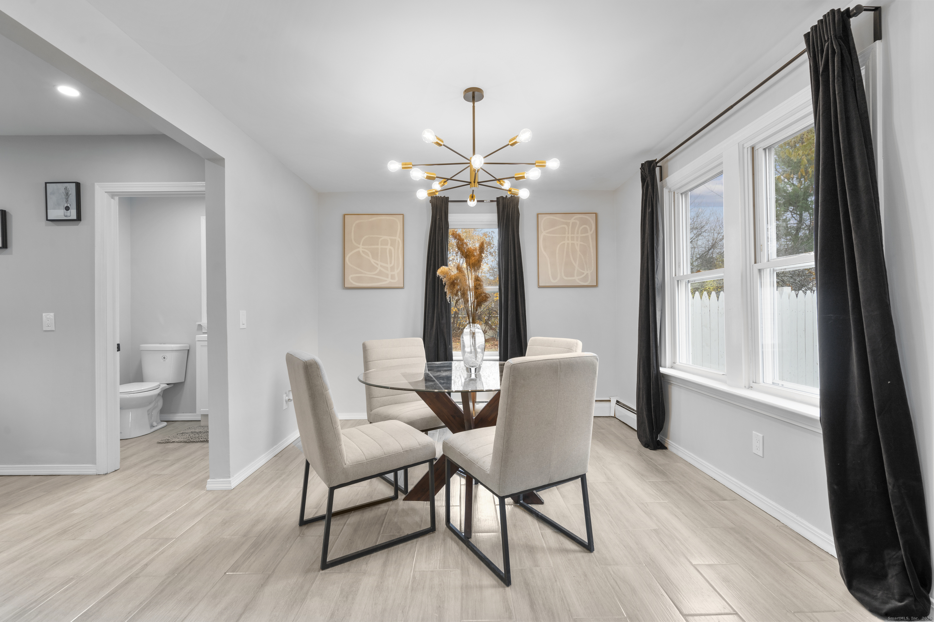 63 Irving Street Manchester, CT 06042 - Photo 9 of 39 a view of a dining room with furniture a chandelier and wooden floor