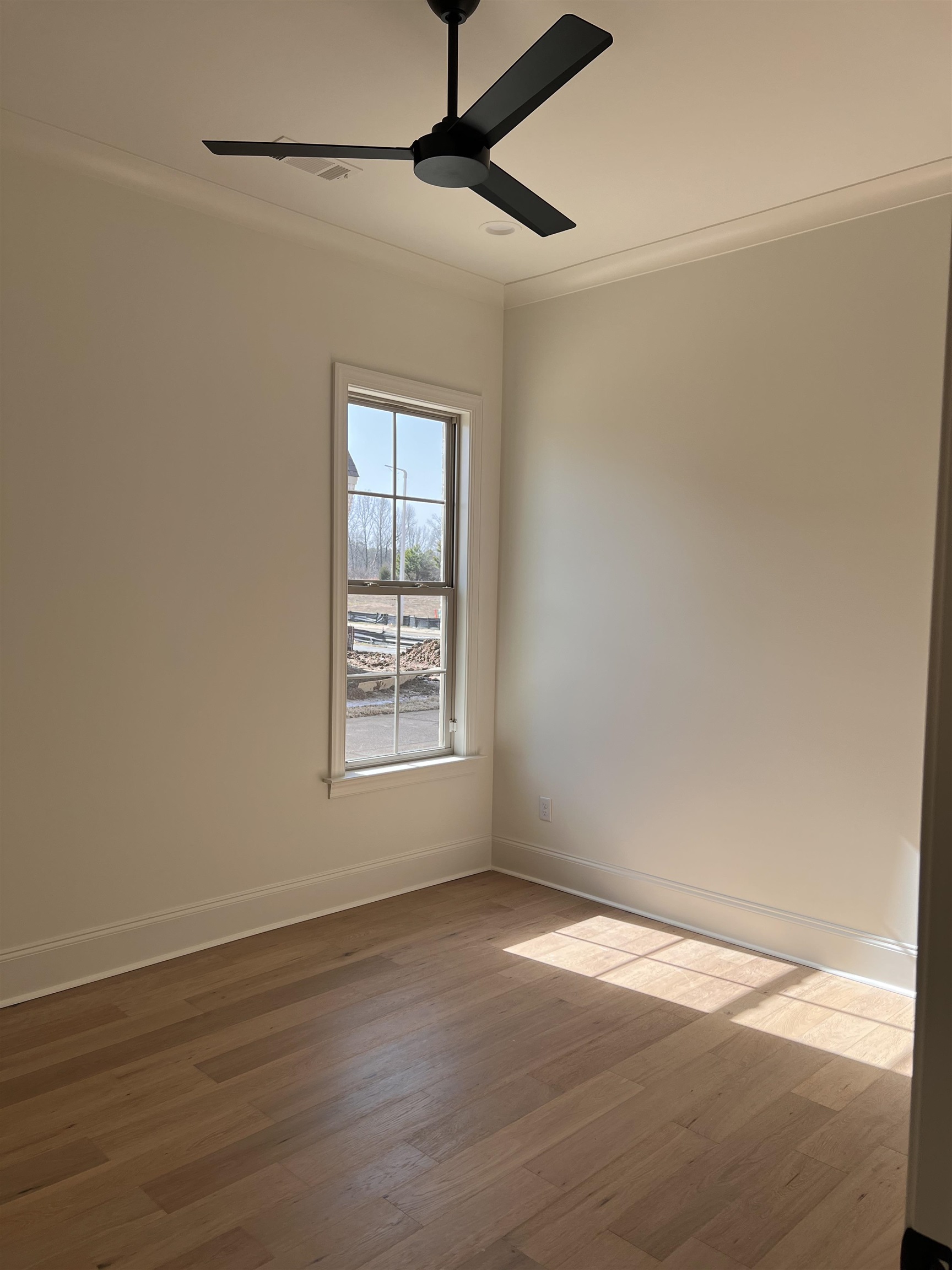 598 Cedar Shadows Circle West Collierville, TN 38017 - Photo 12 of 19 Secondary Bedroom featuring crown molding, ceiling fan, and wood flooring