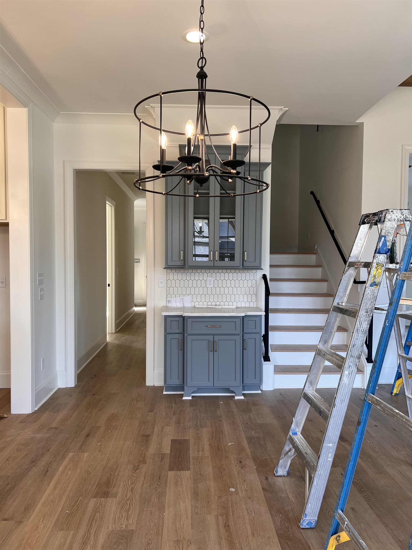 598 Cedar Shadows Circle West Collierville, TN 38017 - Photo 4 of 19 Interior space featuring dark wood-type flooring, crown molding, and a notable chandelier