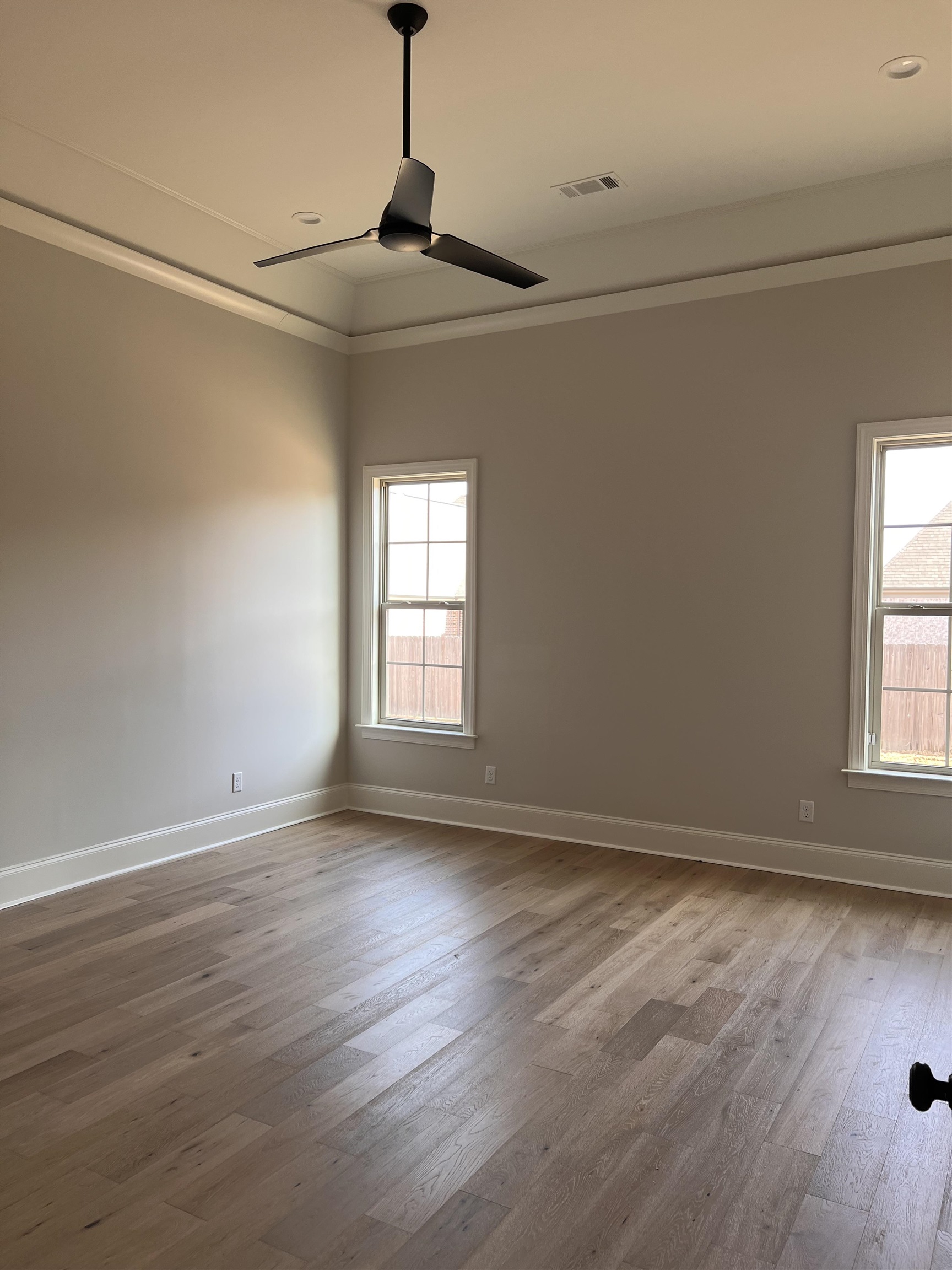 598 Cedar Shadows Circle West Collierville, TN 38017 - Photo 9 of 19 Unfurnished room with crown molding, hardwood / wood floors, and ceiling fan