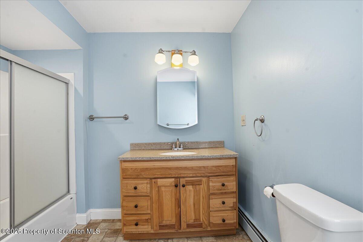 795 Wescott Road New Milford, PA 18834 - Photo 52 of 81 a bathroom with a sink a toilet and mirror
