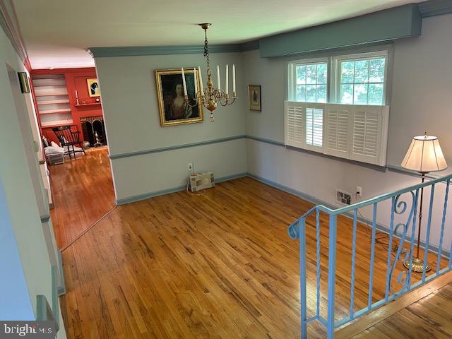 484 Flock Road Hamilton, NJ 08619 - Photo 3 of 25 a view of an empty room with wooden floor and windows