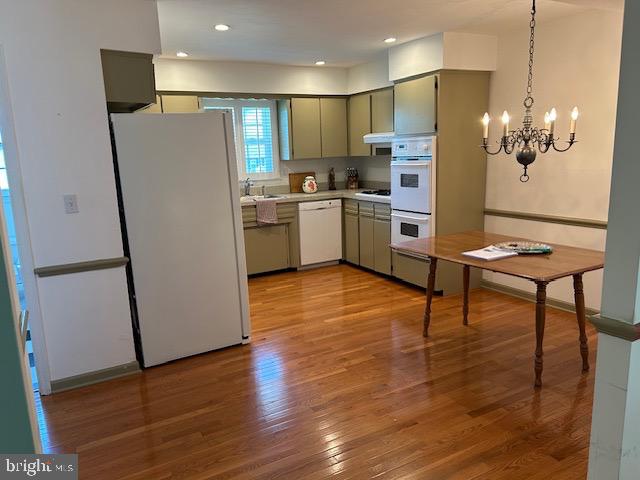 484 Flock Road Hamilton, NJ 08619 - Photo 7 of 25 a kitchen with stainless steel appliances a refrigerator sink and wooden floor