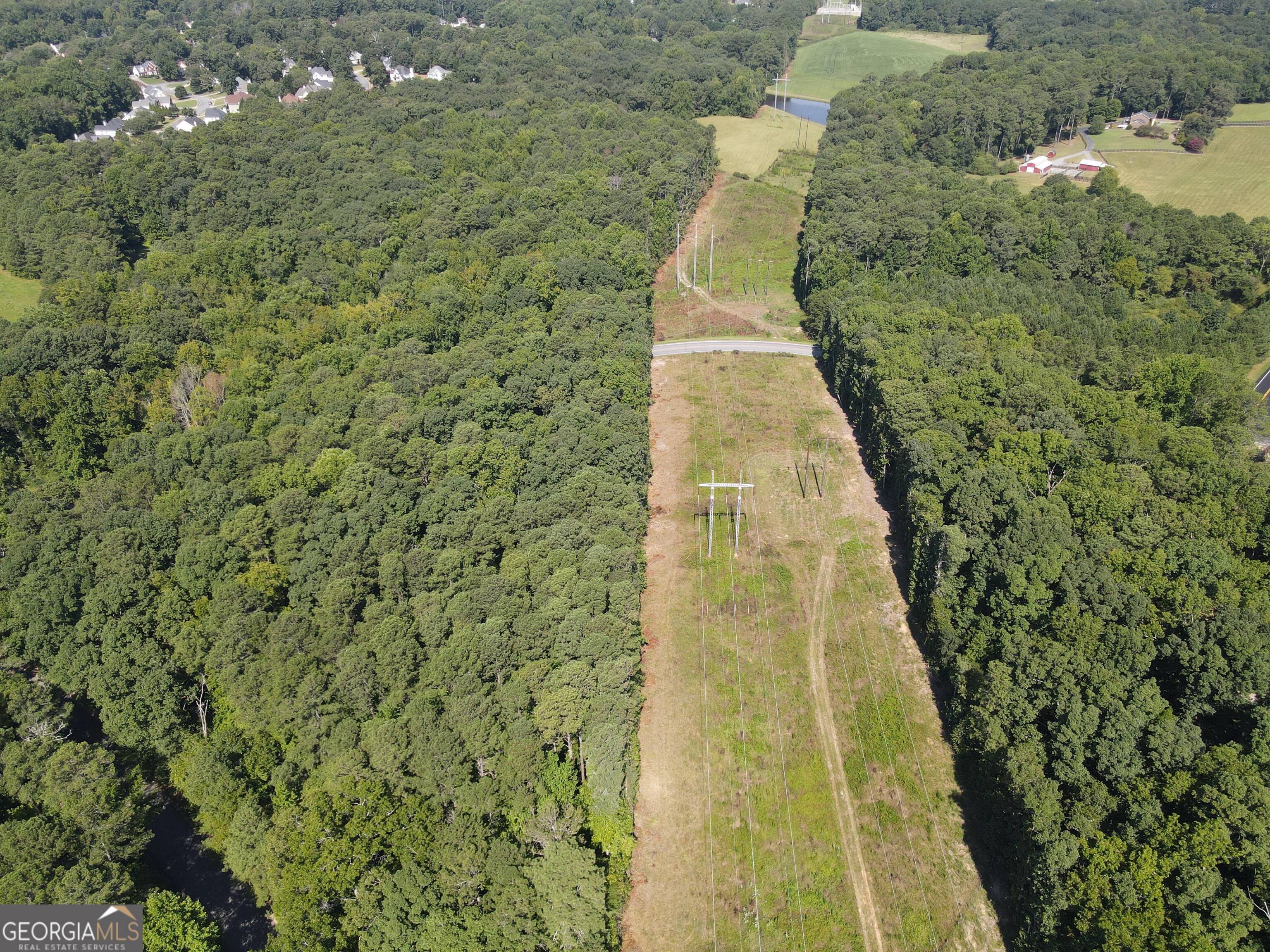 2578 Temple Johnson Road Snellville, GA 30078 - Photo 6 of 18 a building with trees in the background