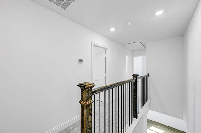 a view of a hallway with a chair