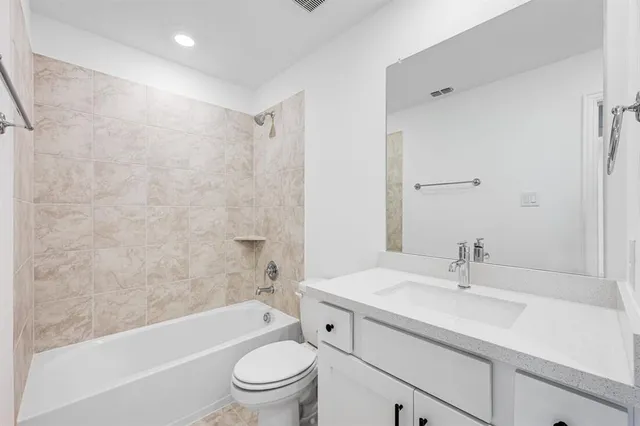 a bathroom with a sink a toilet and a bathtub