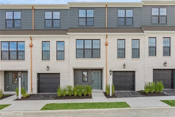 a view of a brick building with many windows