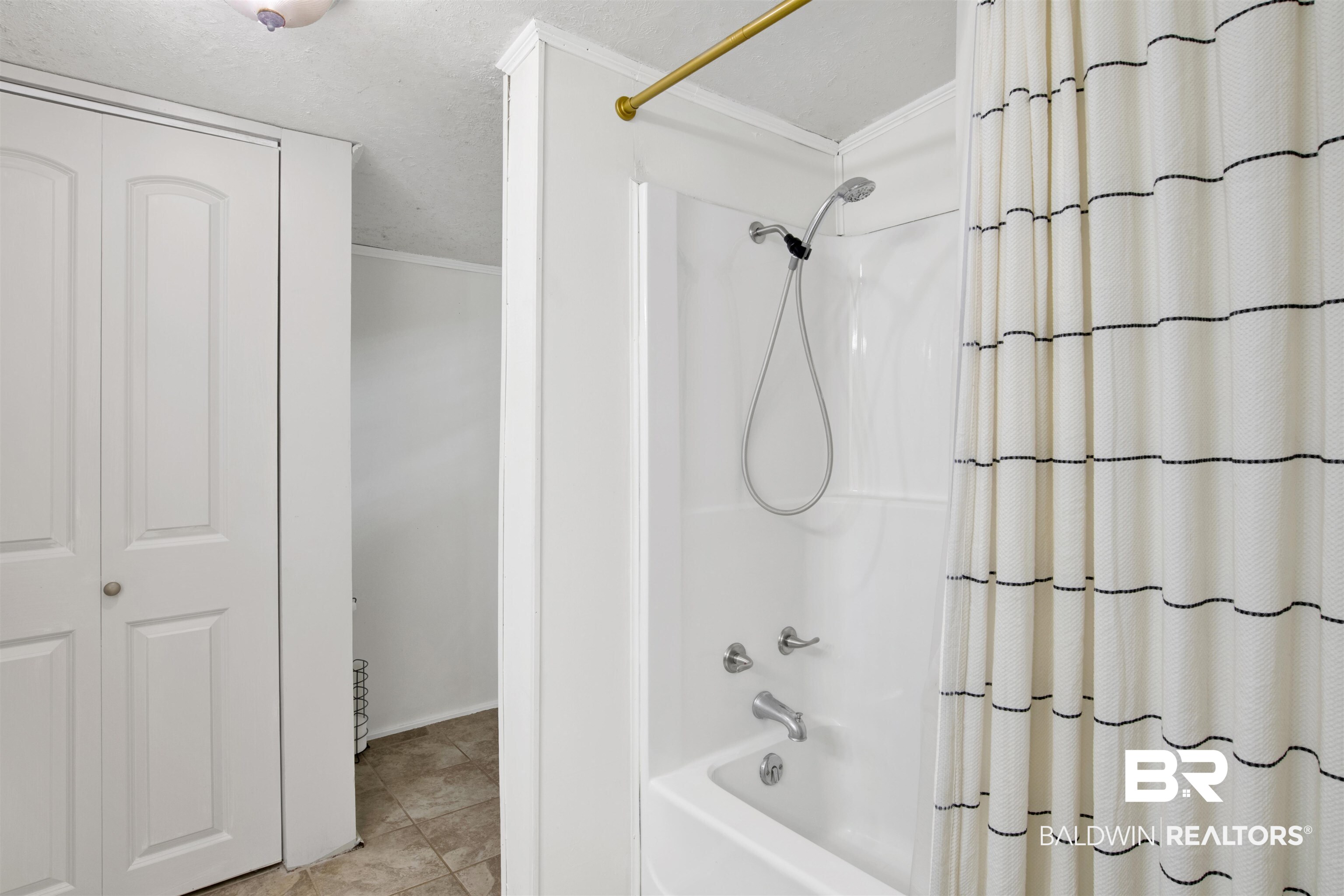 4265 Greaves Road Eight Mile, AL 36613 - Photo 16 of 34 Bathroom with shower / bathtub combination with curtain and ornamental molding