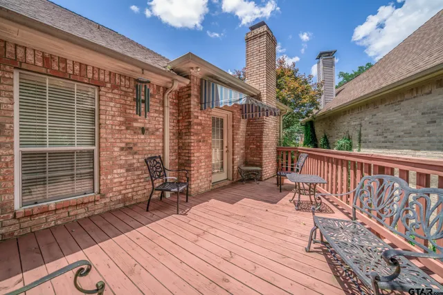 a balcony view with a seating space