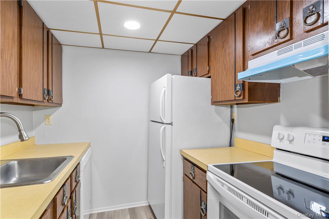 150 Overlook Avenue, Unit 2K Peekskill, NY 10566 - Photo 3 of 26 a kitchen with stainless steel appliances granite countertop a sink stove and refrigerator