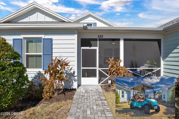 a front view of house with outdoor seating