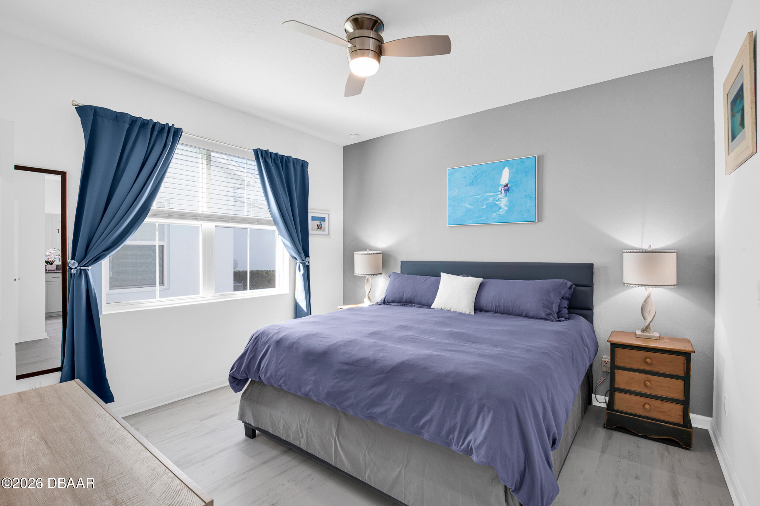 533 Margaritaville Avenue Daytona Beach, FL 32124 - Photo 11 of 43 a bedroom with a bed and a window