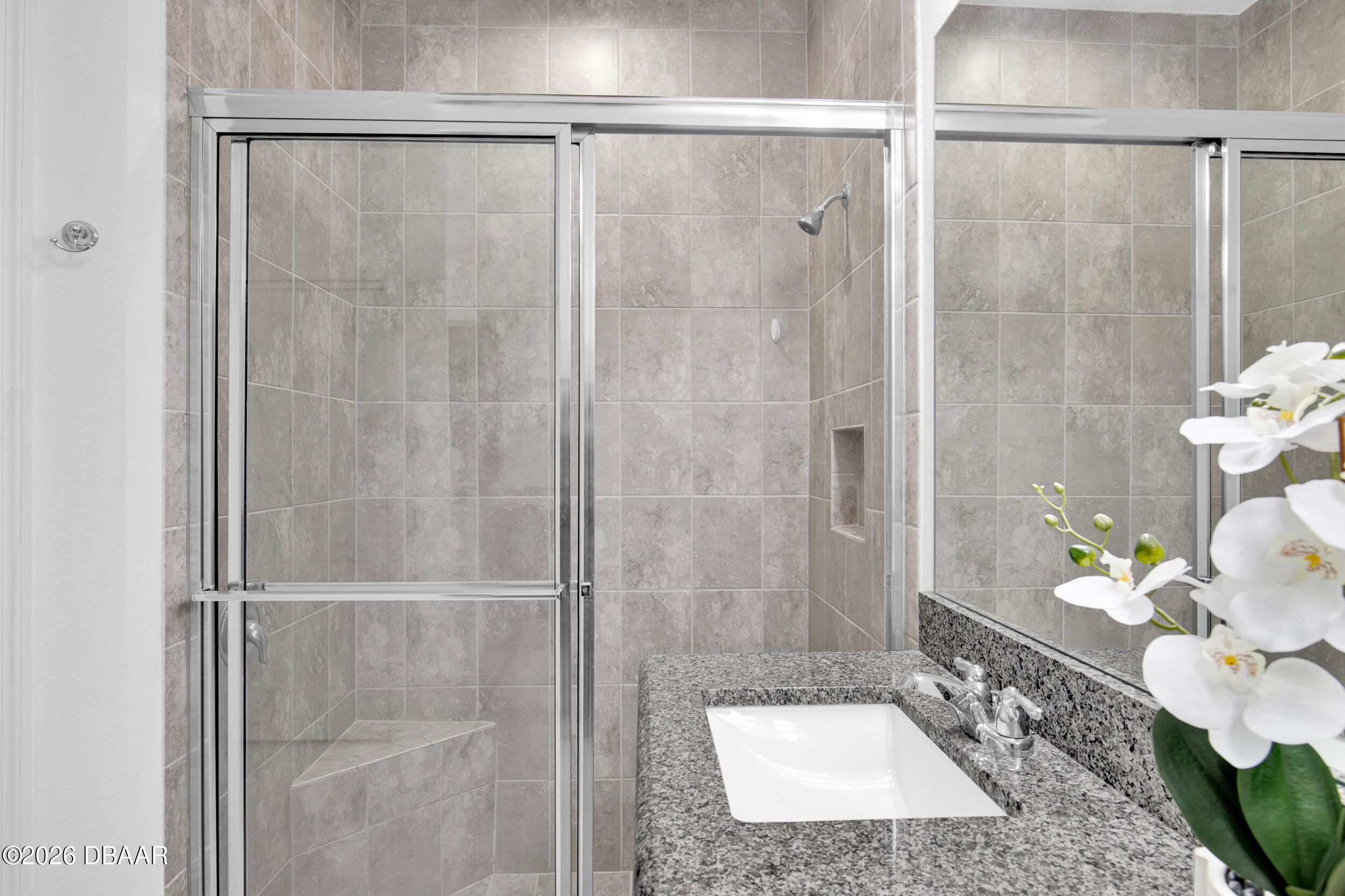 533 Margaritaville Avenue Daytona Beach, FL 32124 - Photo 14 of 43 a bathroom with a shower and a sink