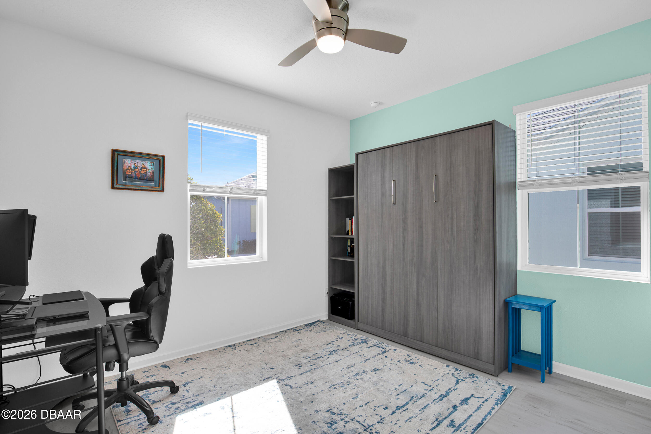 533 Margaritaville Avenue Daytona Beach, FL 32124 - Photo 16 of 43 a view of a workspace with furniture and a window