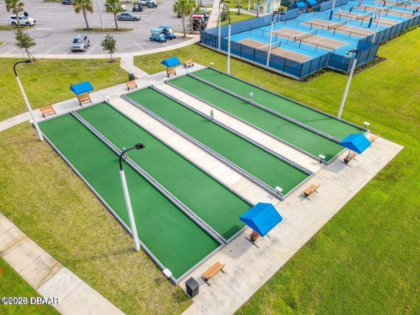 533 Margaritaville Avenue Daytona Beach, FL 32124 - Photo 30 of 43 a view of a swimming pool with a lawn chairs