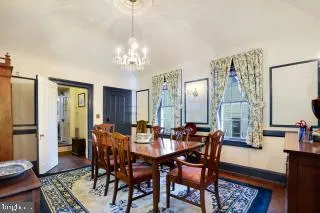 a large kitchen with a table and chairs in it