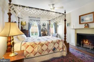 a bedroom with a bed window and couch