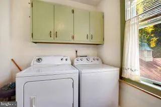 a bedroom with a bed and a fireplace