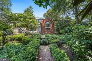 a aerial view of a house with a yard