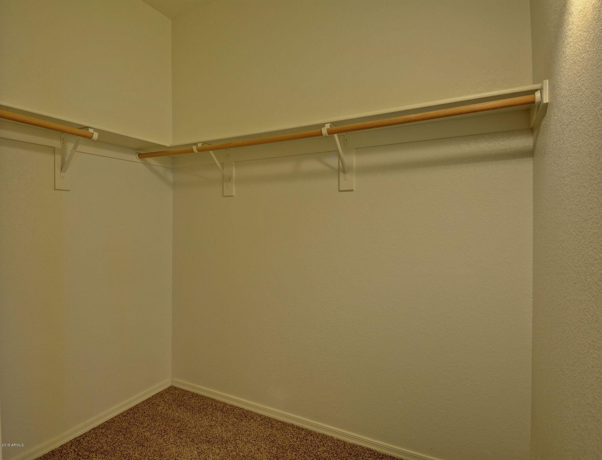 3150 East Beardsley Road, Unit 1028 Phoenix, AZ 85050 - Photo 16 of 29 Master Walk In Closet