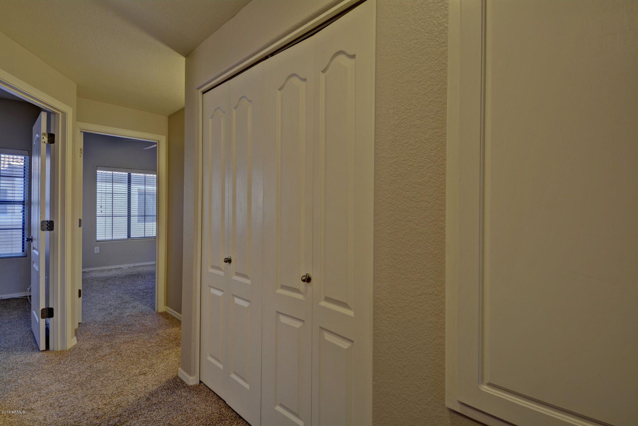 3150 East Beardsley Road, Unit 1028 Phoenix, AZ 85050 - Photo 17 of 29 Hallway to secondary Bedrooms