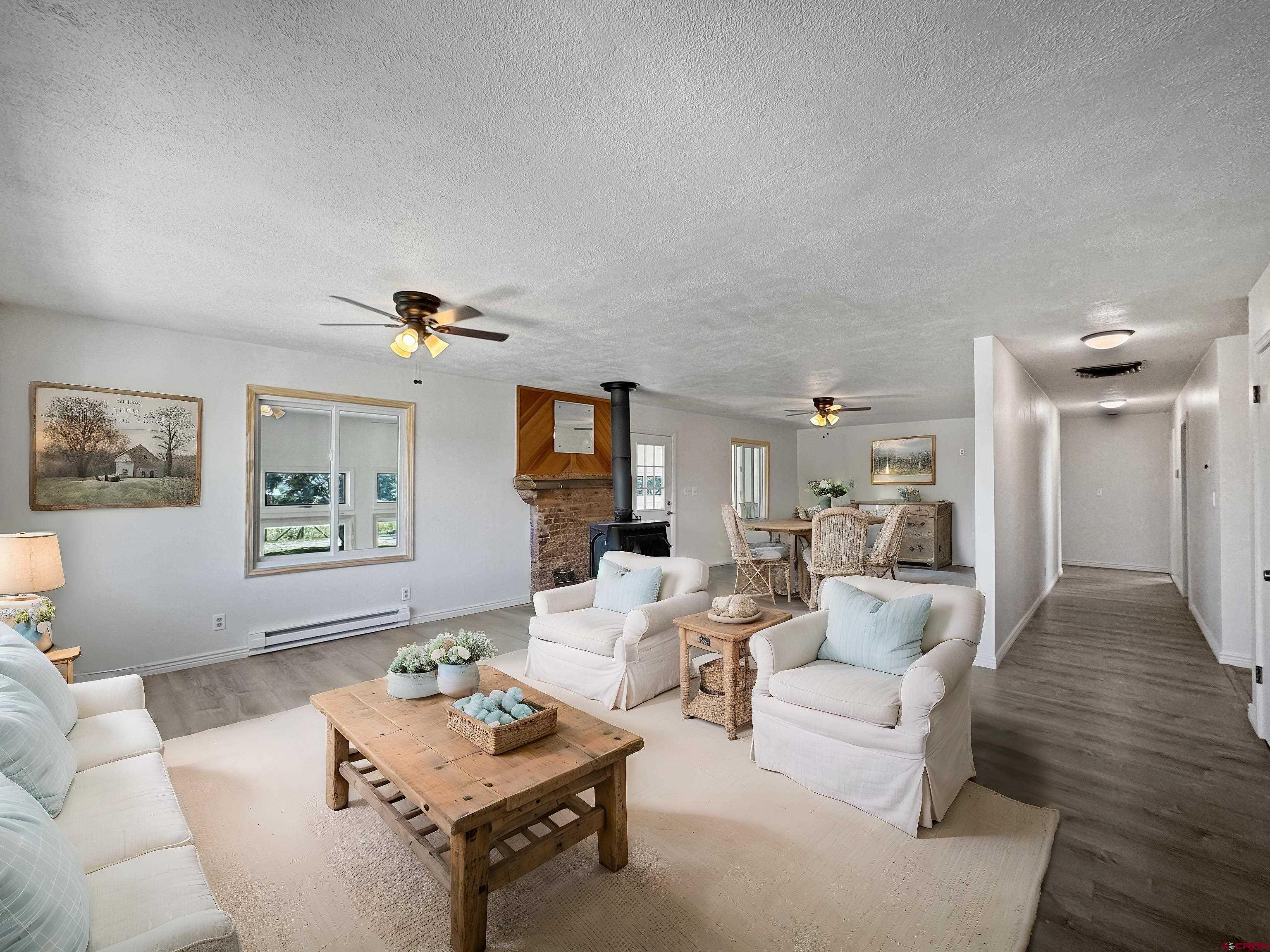 9627 3200th Road Hotchkiss, CO 81419 - Photo 22 of 44 a living room with furniture and a wooden floor