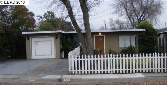 519 Levee Road Bay Point, CA 94565 - Photo 1 of 1 a front view of a house with a garden