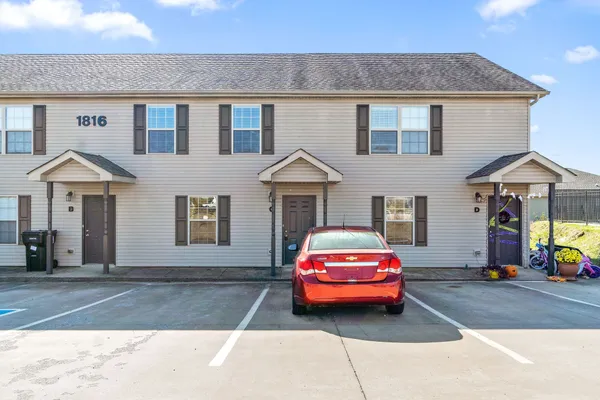 a car parked in front of a house