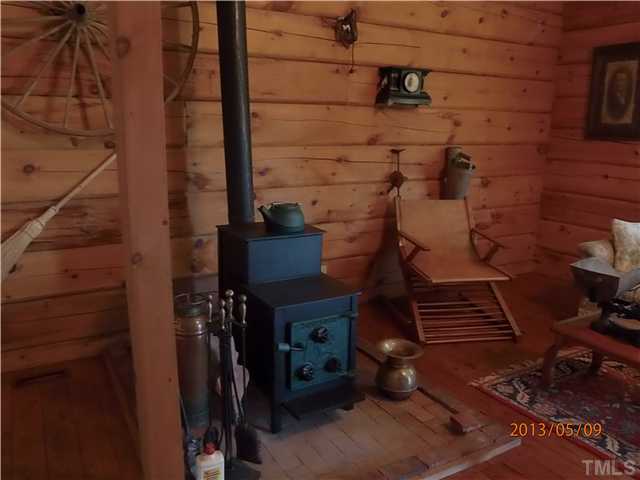 8724 Flower Hill Road Middlesex, NC 27557 - Photo 19 of 25 woodstove in family room