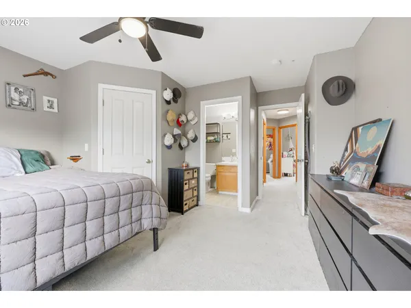 a bedroom with a bed and ceiling fan