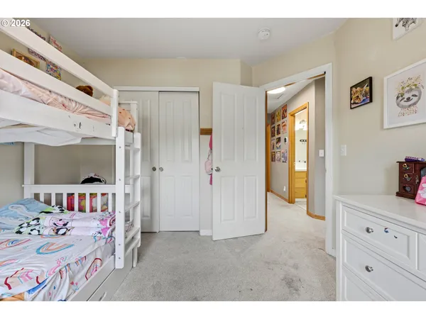 a room that has a bed and a dresser in it