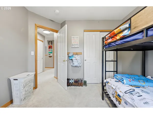 a bedroom with a bed and a dresser