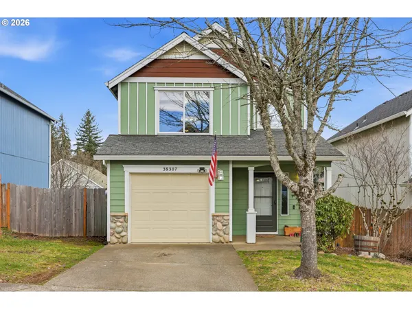 a view of house with yard