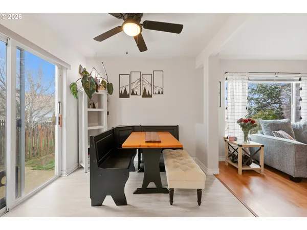 a living room with furniture pool table and flat screen tv