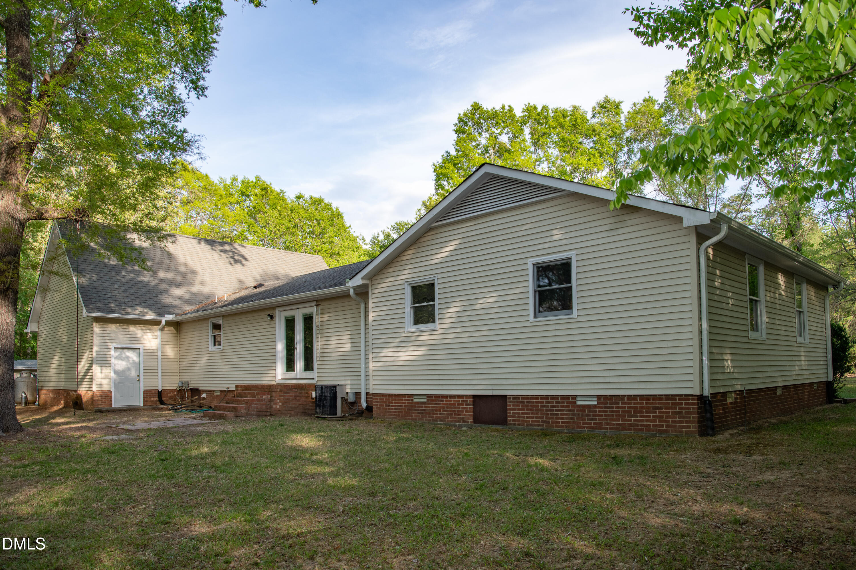 230 Hillsborough Road Timberlake, NC 27583 - Photo 5 of 15 a front view of a house with a garden