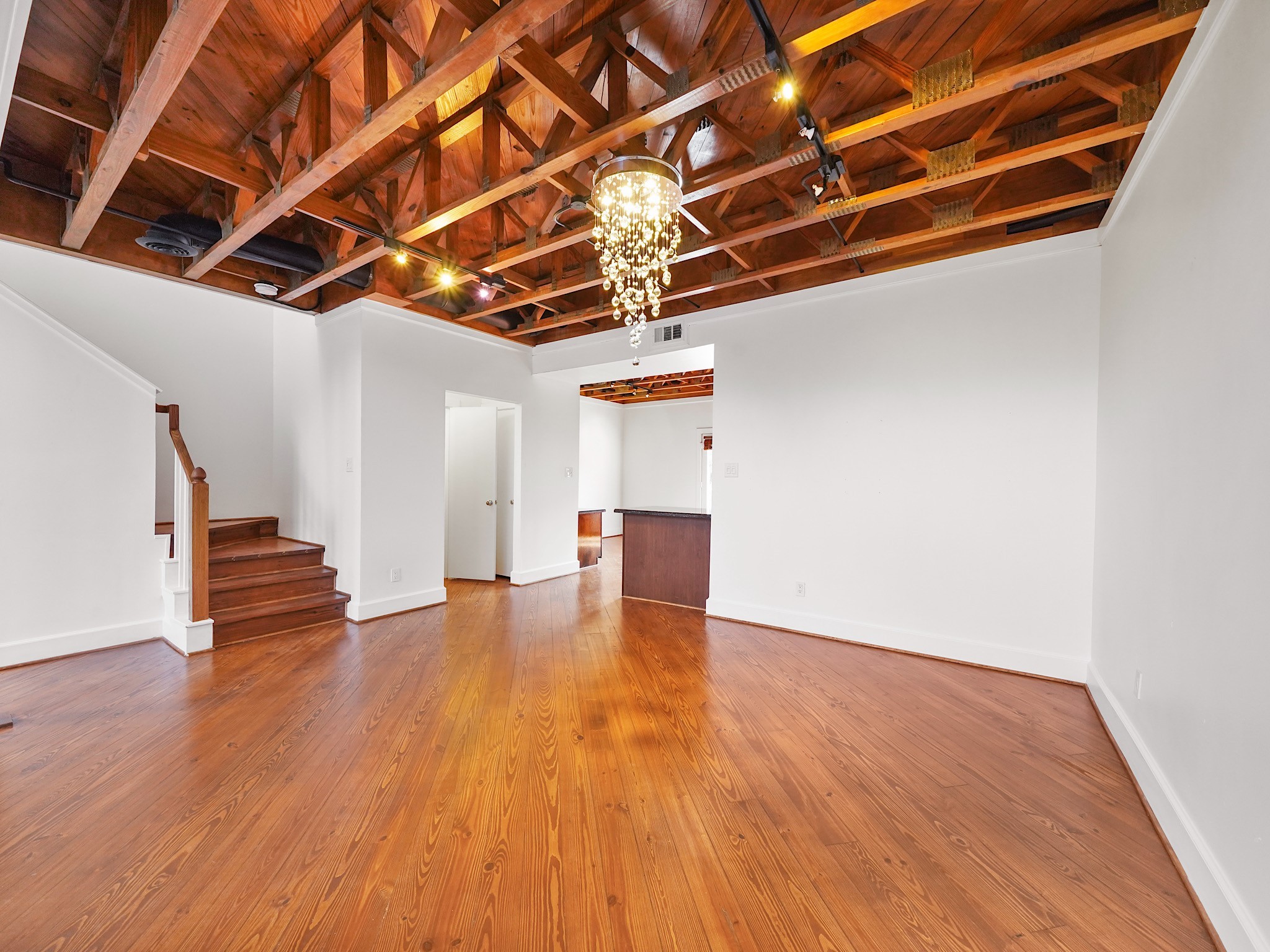 907 Hartman Street Houston, TX 77007 - Photo 11 of 34 a view of empty room with wooden floor