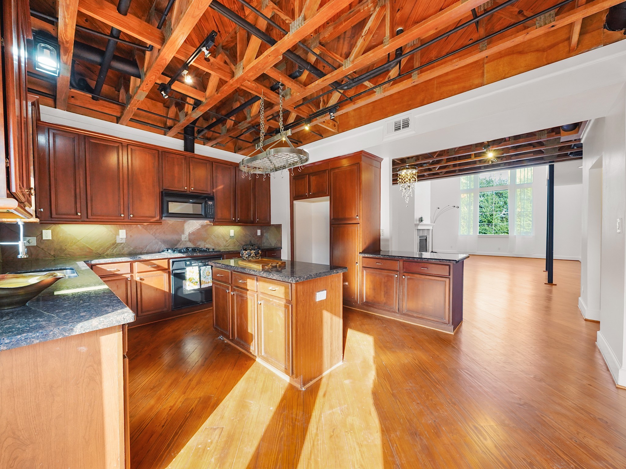 907 Hartman Street Houston, TX 77007 - Photo 17 of 34 a kitchen with stainless steel appliances granite countertop a stove a sink and a wooden floors