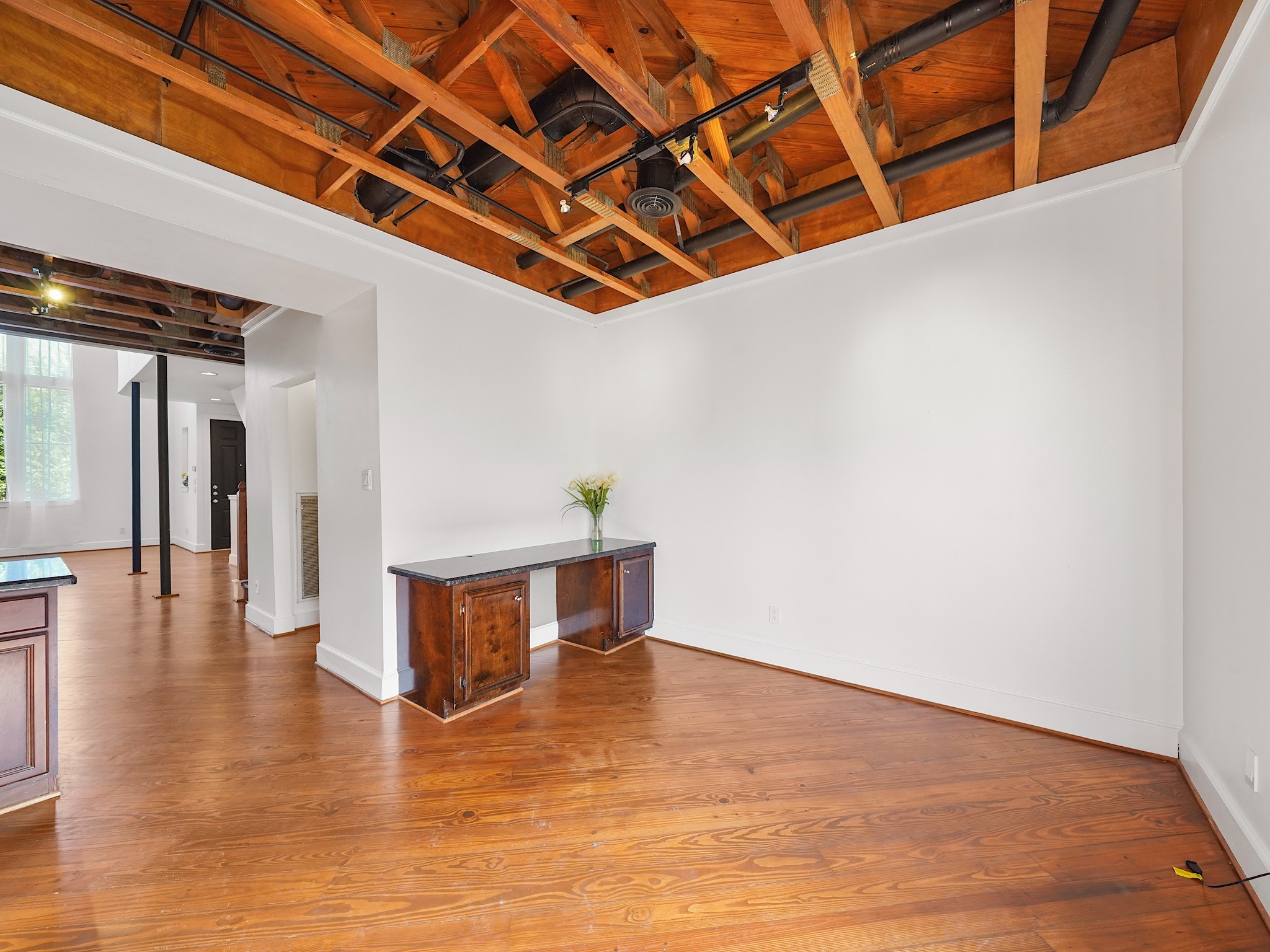 907 Hartman Street Houston, TX 77007 - Photo 19 of 34 a view of an empty room with wooden floor