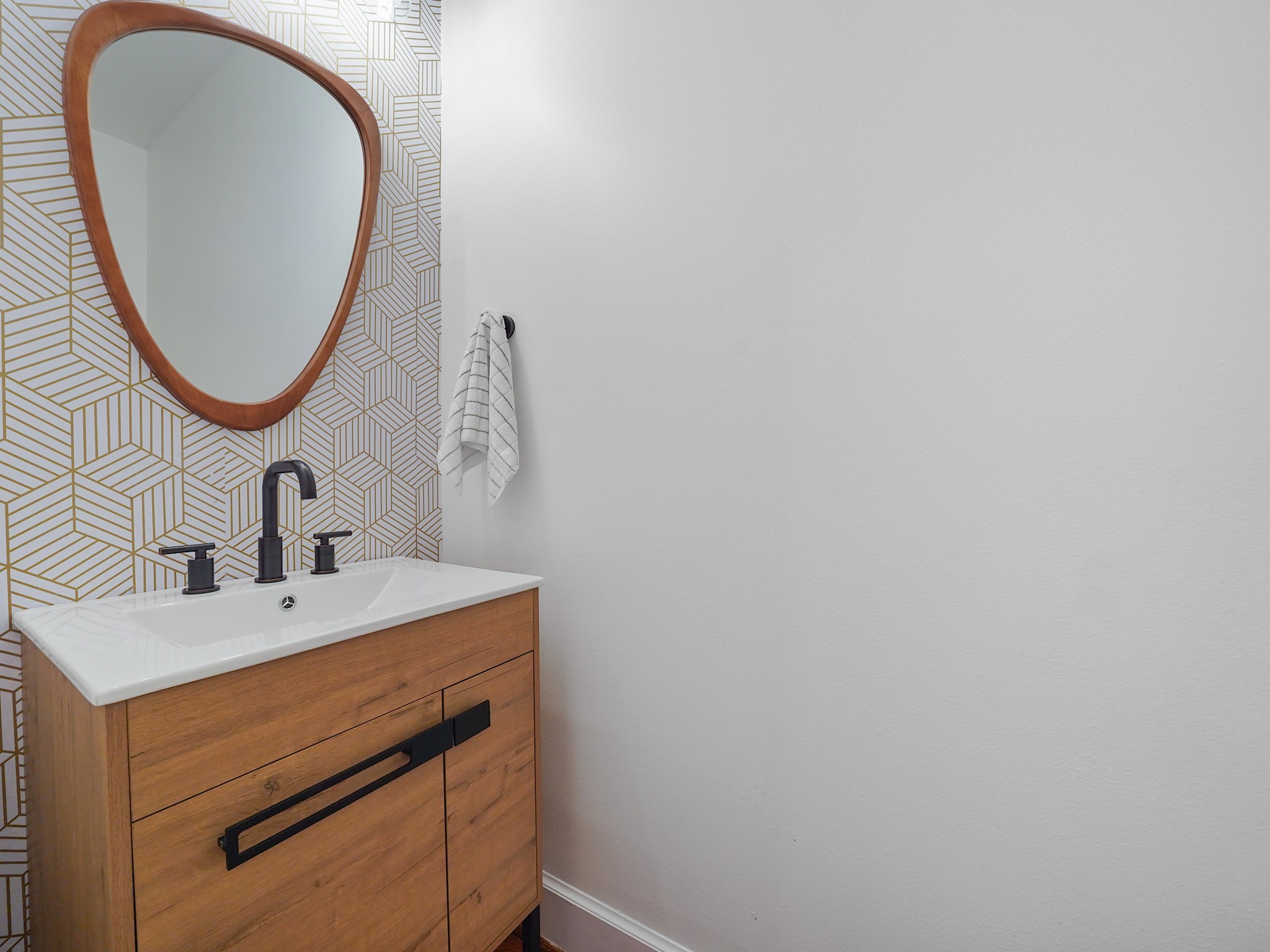 907 Hartman Street Houston, TX 77007 - Photo 21 of 34 a bathroom with a sink and a mirror