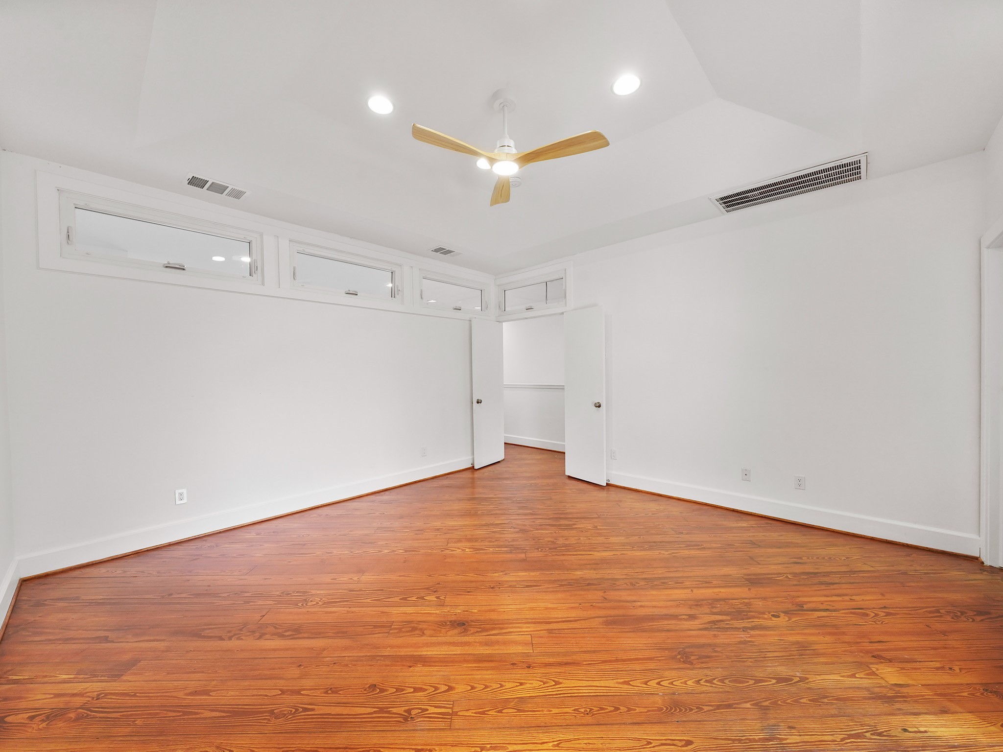907 Hartman Street Houston, TX 77007 - Photo 24 of 34 an empty room with an empty space and wooden floor