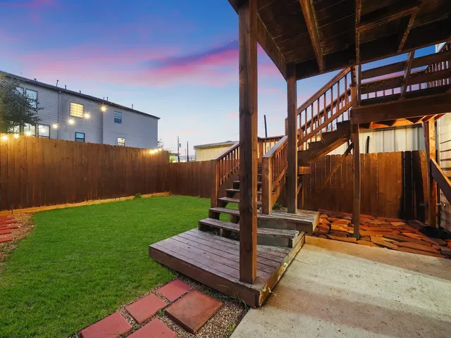 a view of a backyard with sitting area