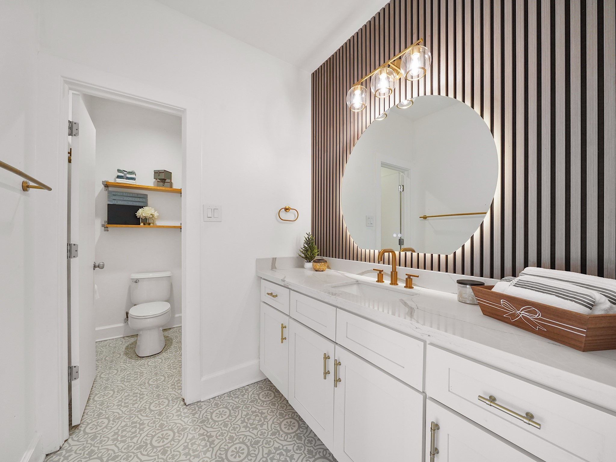 907 Hartman Street Houston, TX 77007 - Photo 5 of 34 a en suite bathroom with a granite countertop toilet and a sink