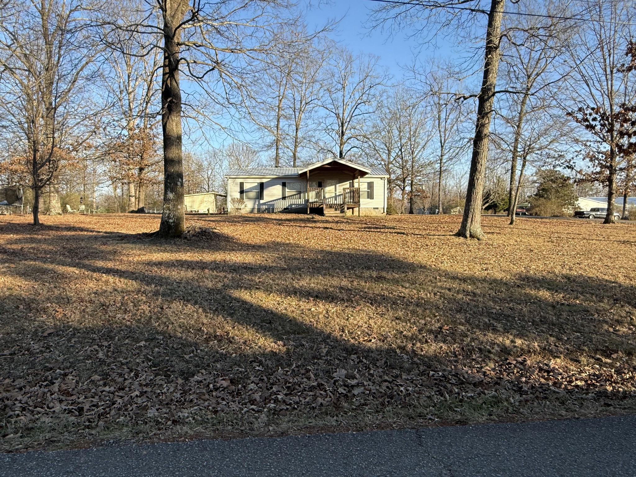 213 Alps Drive Hohenwald, TN 38462 - Photo 13 of 17 a view of a yard with a house