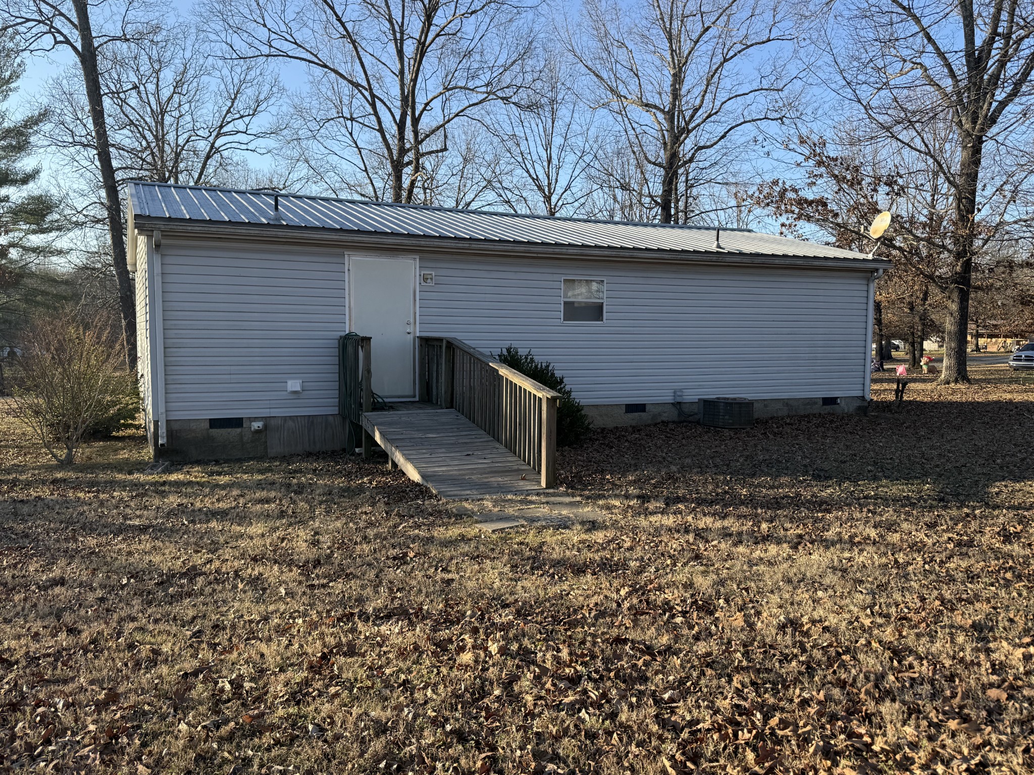213 Alps Drive Hohenwald, TN 38462 - Photo 14 of 17 a view of a house with a yard