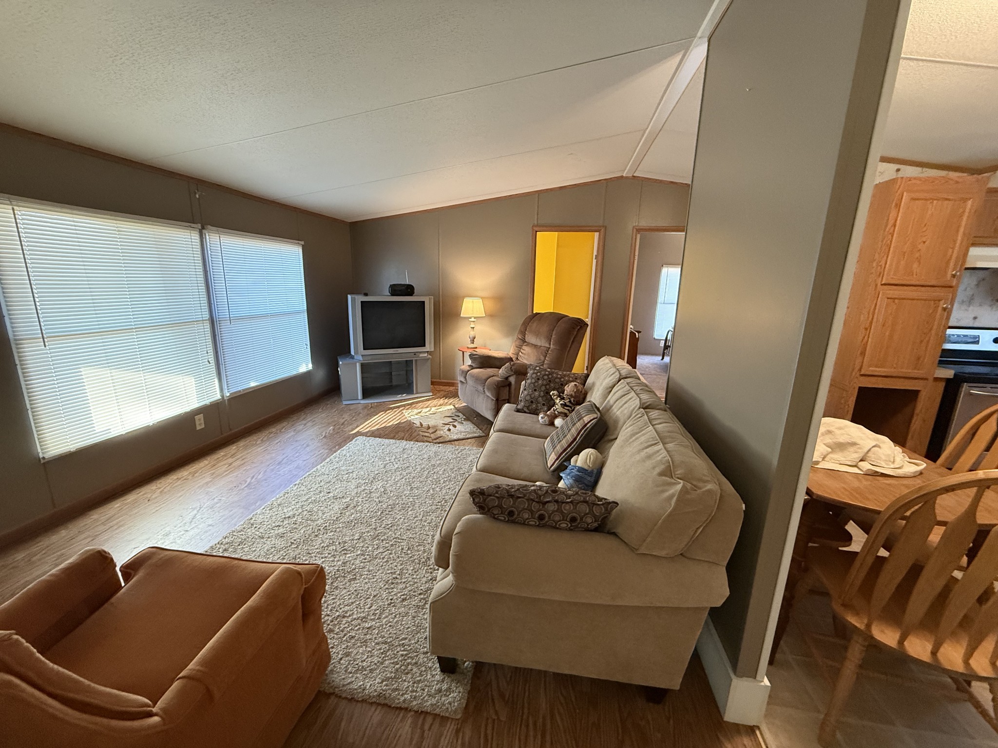 213 Alps Drive Hohenwald, TN 38462 - Photo 7 of 17 a living room with furniture and a flat screen tv