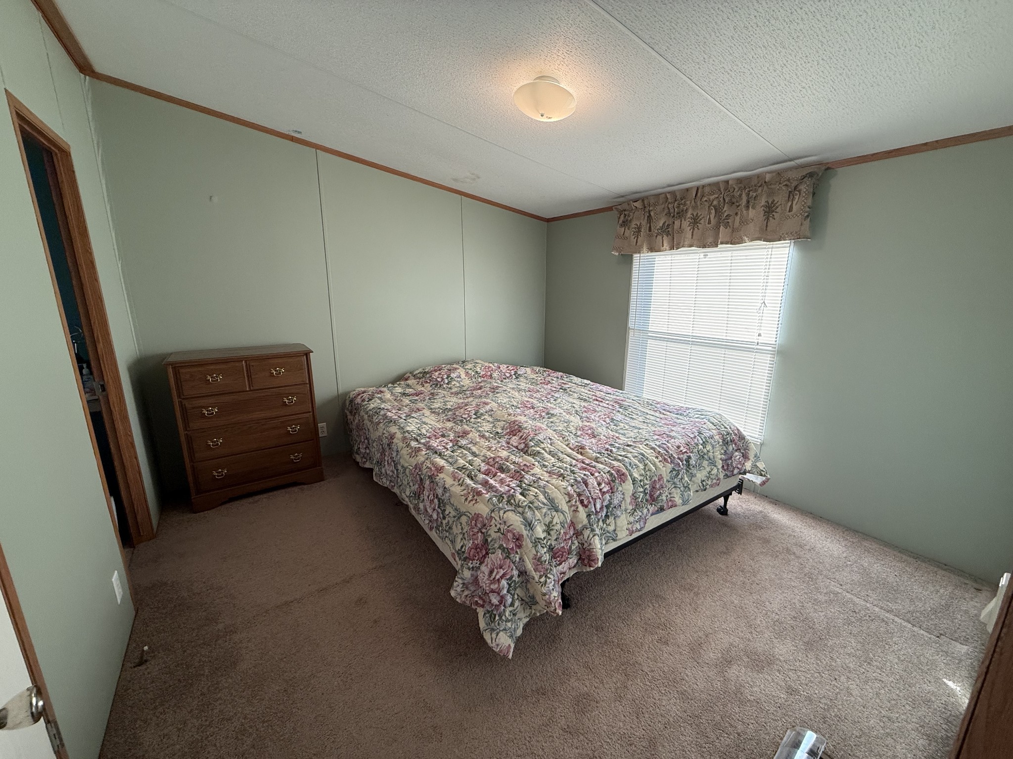 213 Alps Drive Hohenwald, TN 38462 - Photo 8 of 17 a bedroom with a bed and a window
